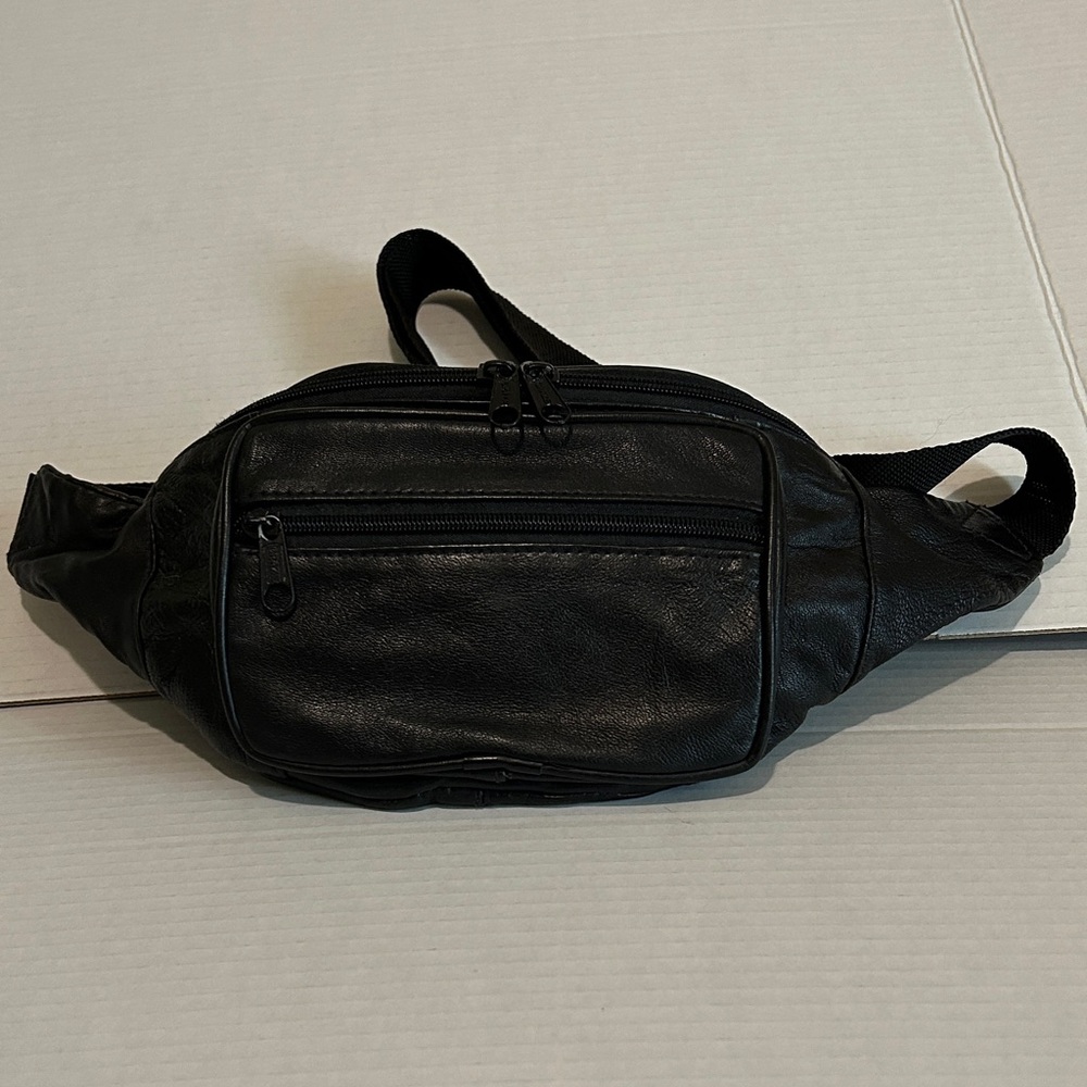 Vintage Black Leather waist pack. 3 separate zippered pouches.Soft leather.
